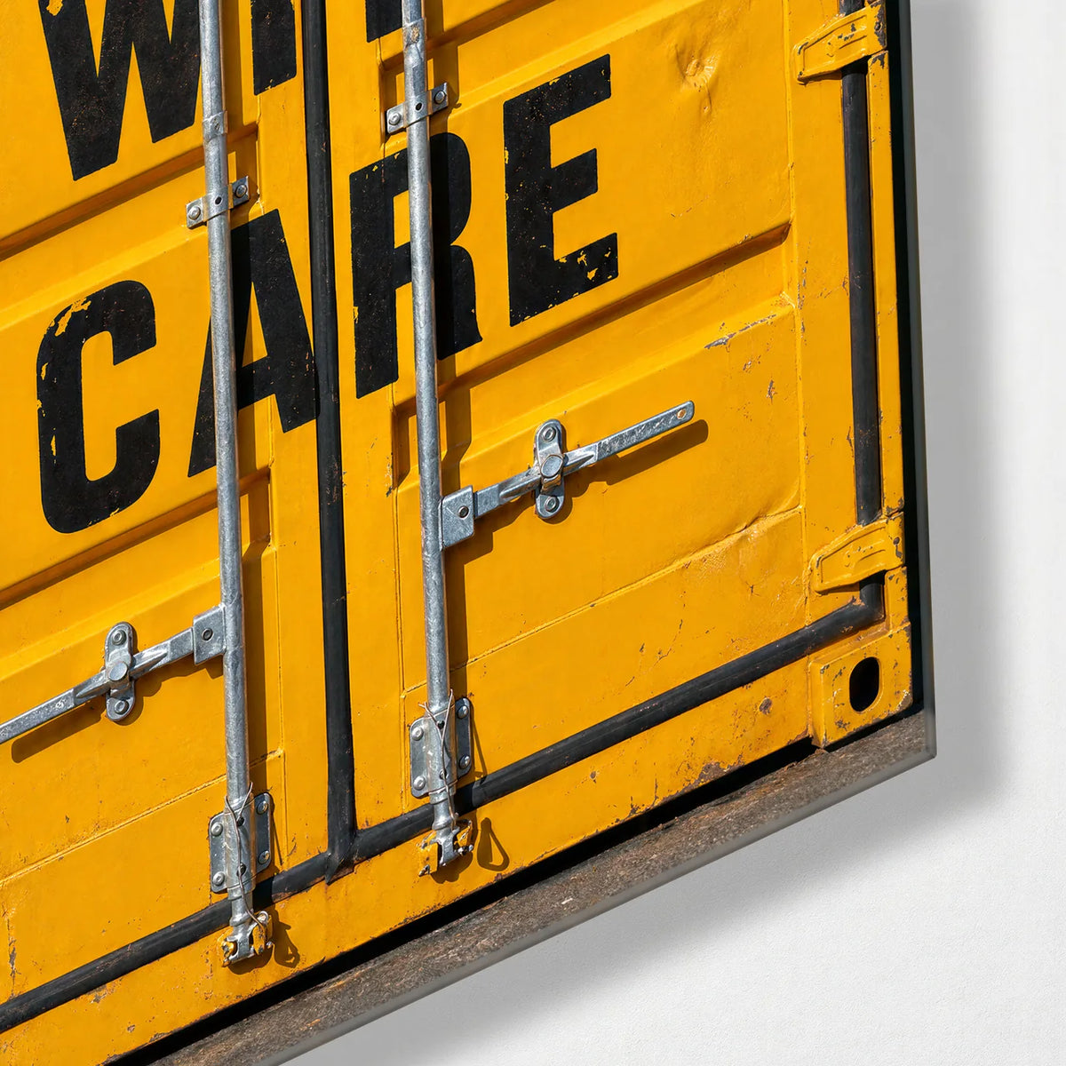 Handle With Care — corner detail of glass wall art