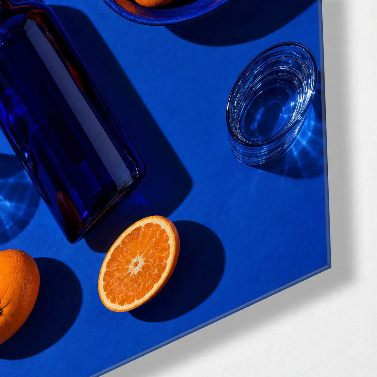 Oranges at the Table — corner detail of glass wall art