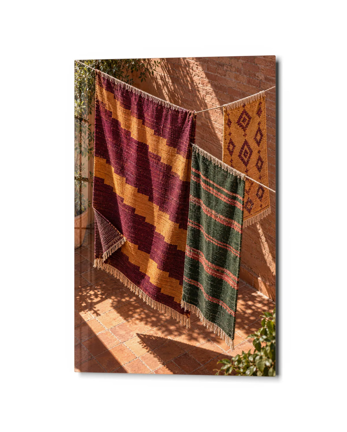 Rugs in the Sun — studio view of glass wall art