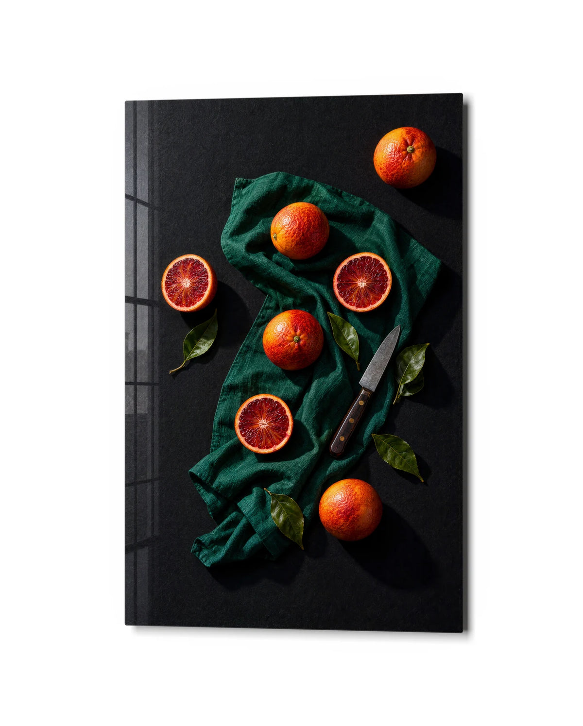 Blood Oranges on Green — studio view of glass wall art