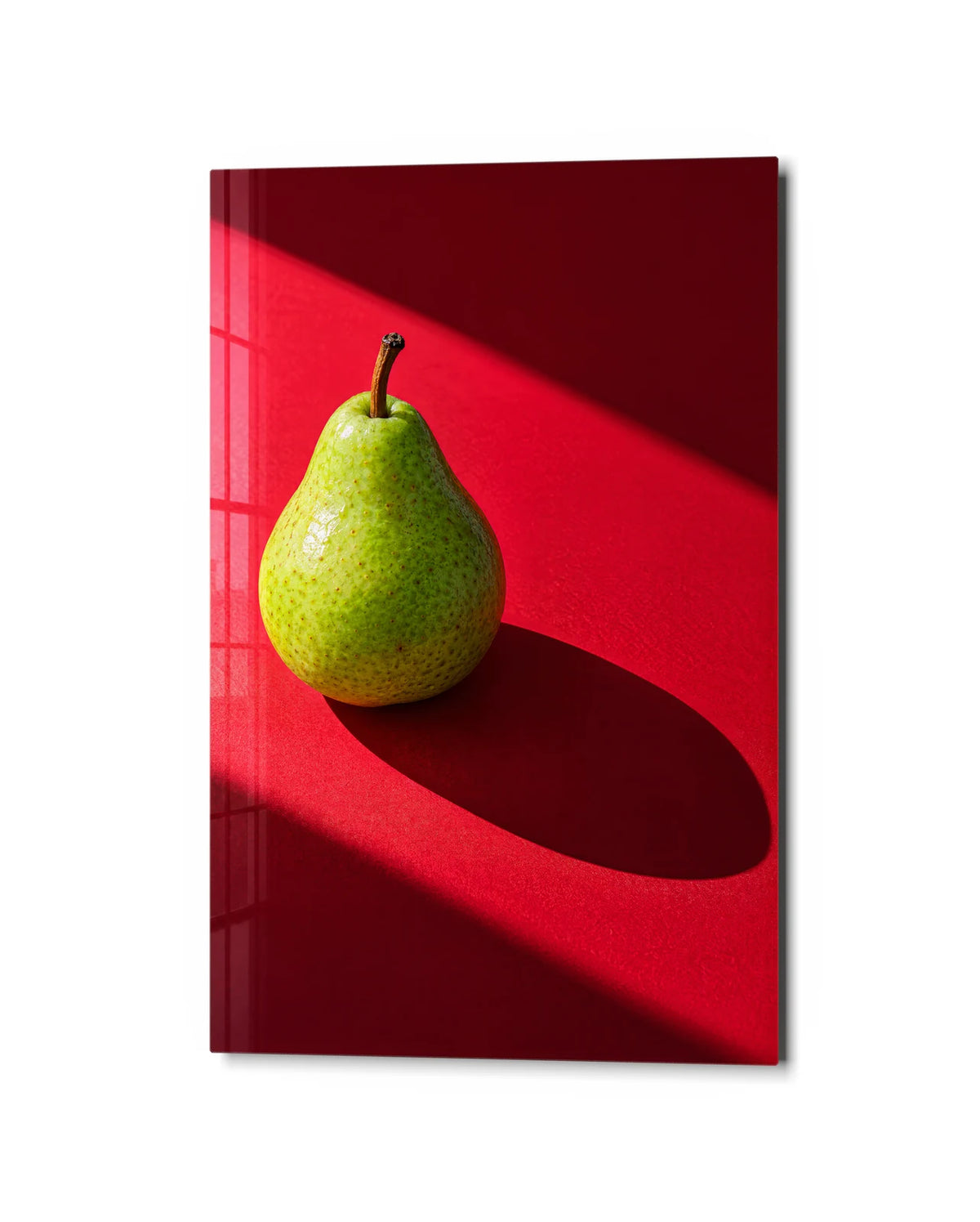 Pear with a Long Shadow — studio view of glass wall art
