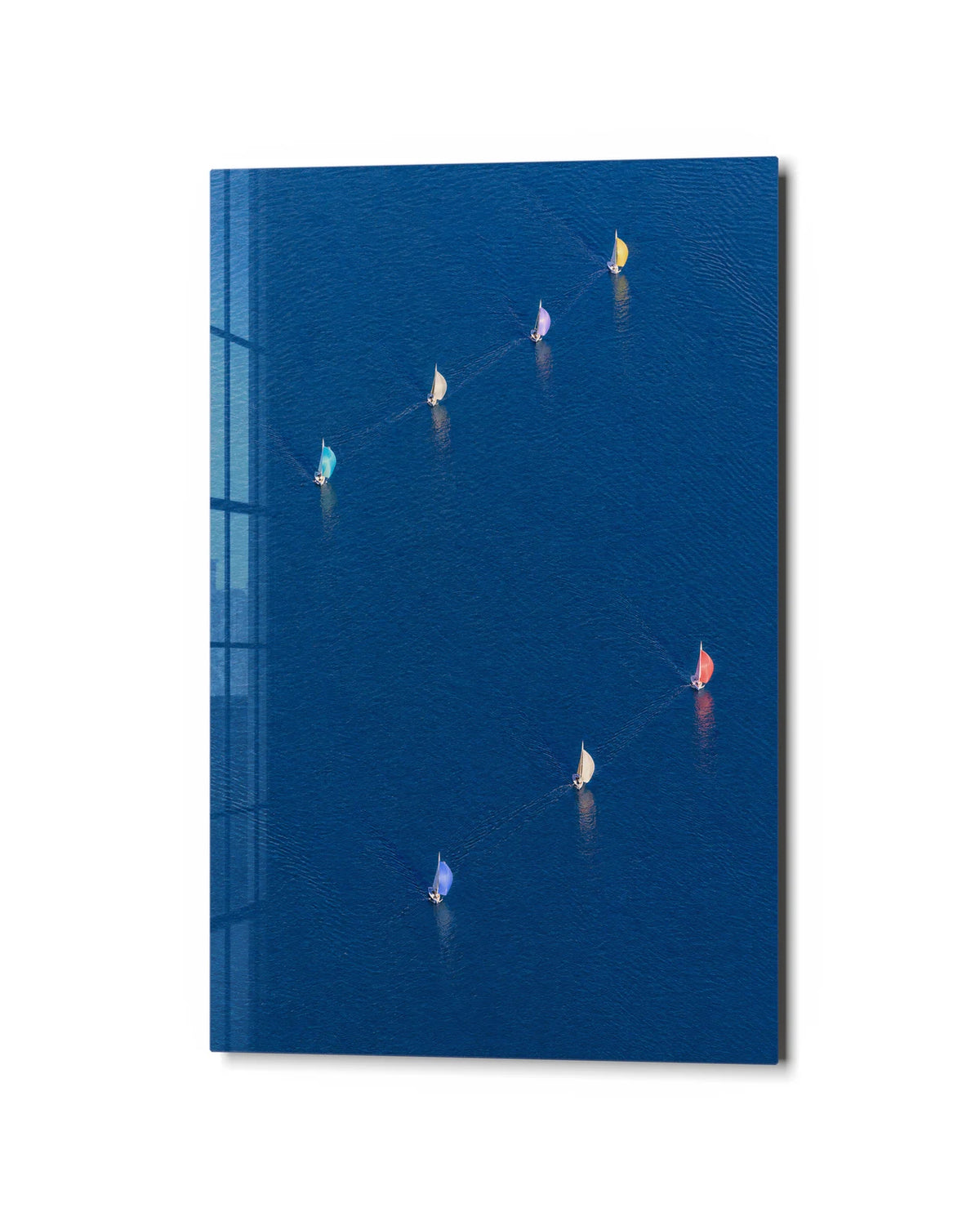 Sails Across Blue — studio view of glass wall art