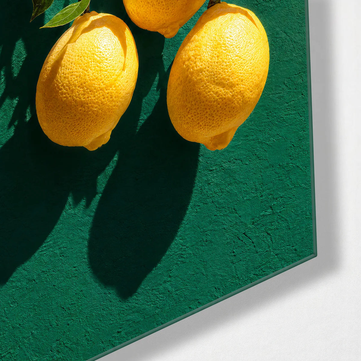 Three Lemons Hanging — corner detail of glass wall art
