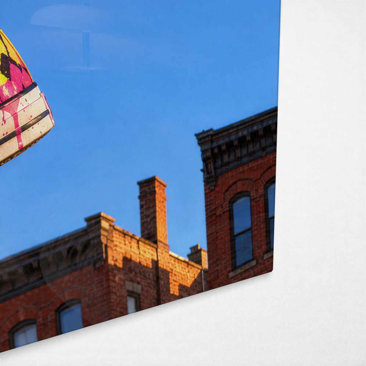 Sneakers on the Wire — corner detail of glass wall art