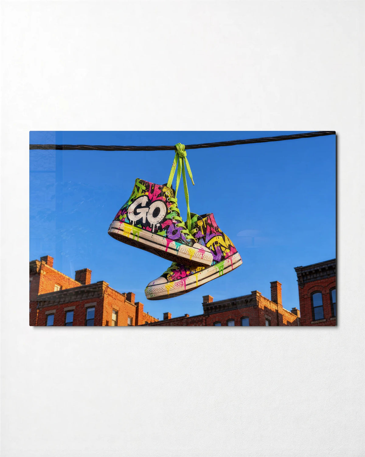 Sneakers on the Wire — front view of glass wall art