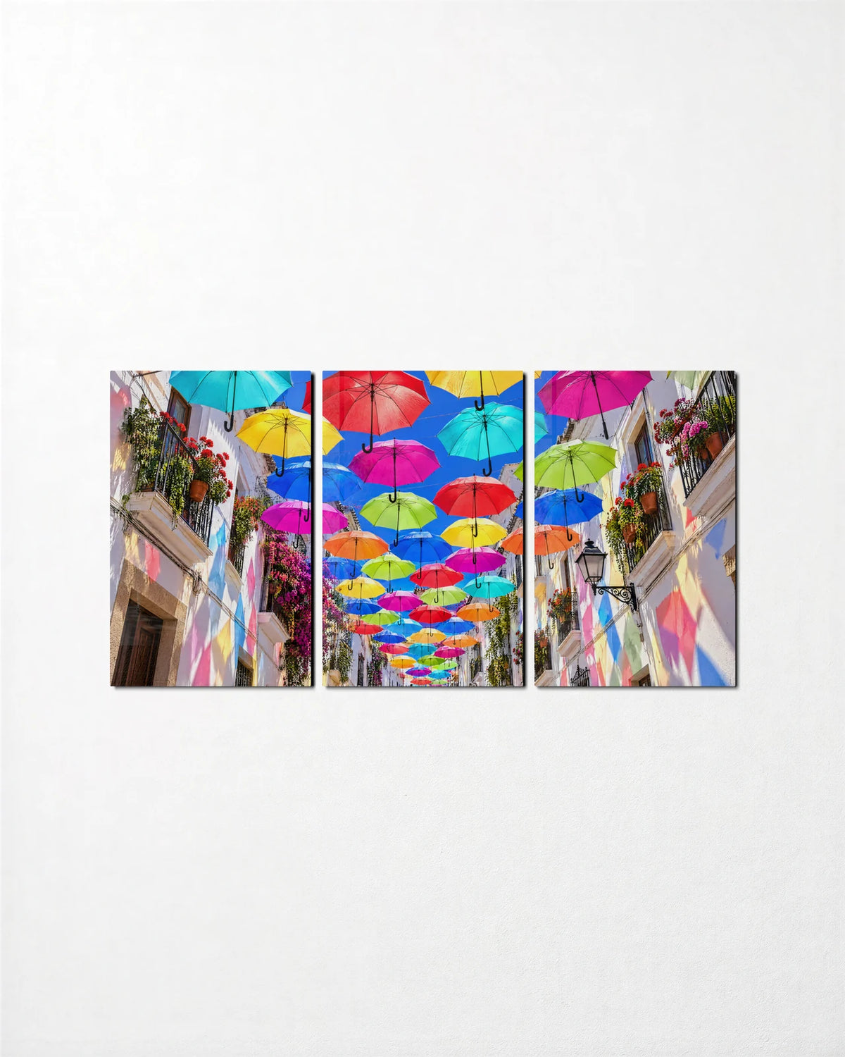 Umbrella Sky Trio — 3-panel glass wall art set on a wall