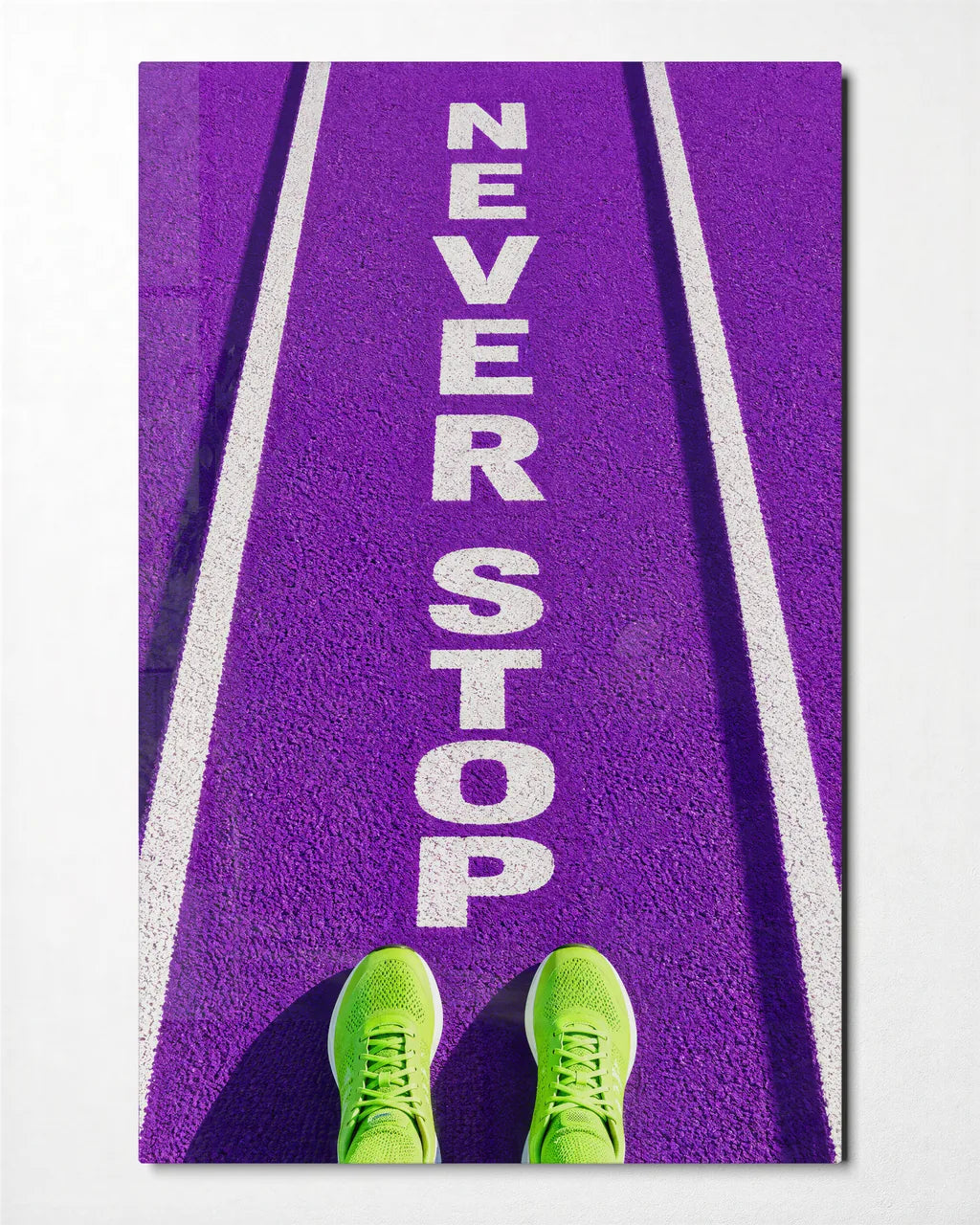 Never Stop — front view of glass wall art