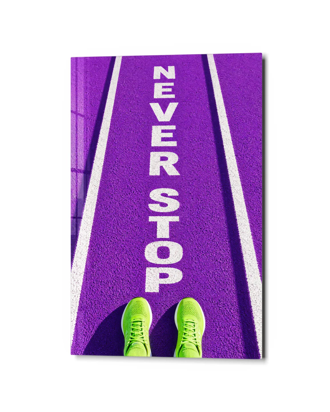 Never Stop — studio view of glass wall art