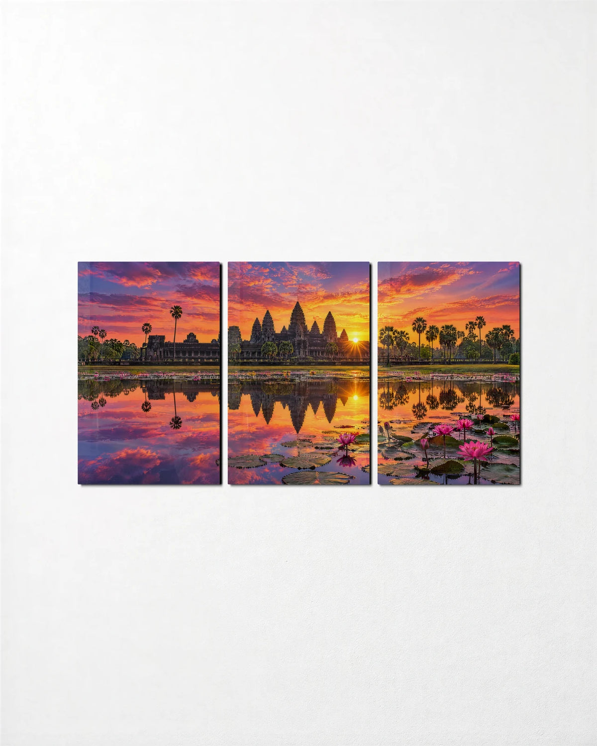 Angkor at Sunrise Trio — 3-panel glass wall art set on a wall